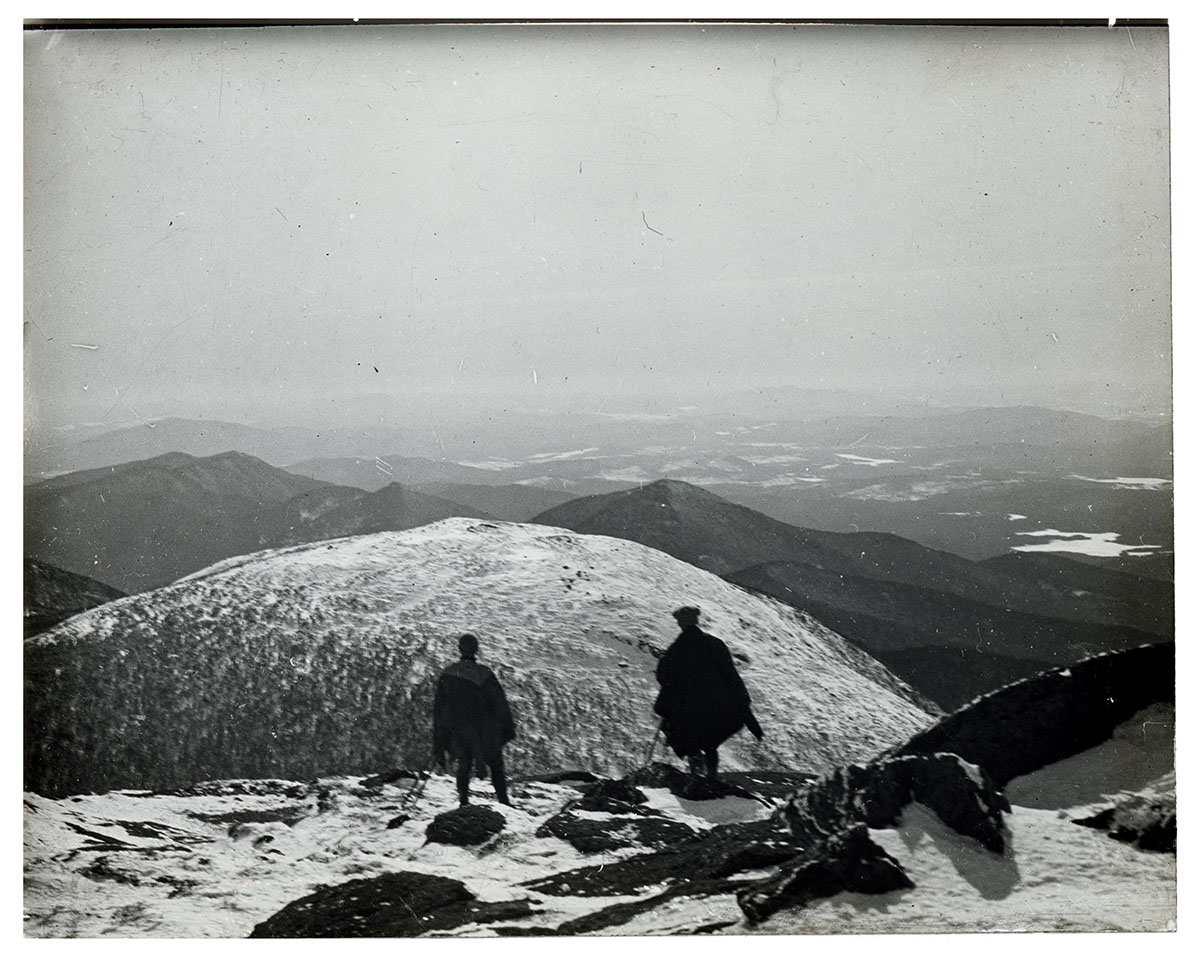 John S. Apperson Jr. and Dr. Irving Langmuir looking out over the Adirondack Mountains from the summit of Mount Marcy, NY in 1912.